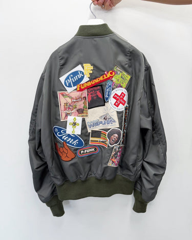 27SS予約受付中<br>【JUNYA WATANABE MAN】<br>"George Clinton" MULTI PATCH BOMBER JACKET