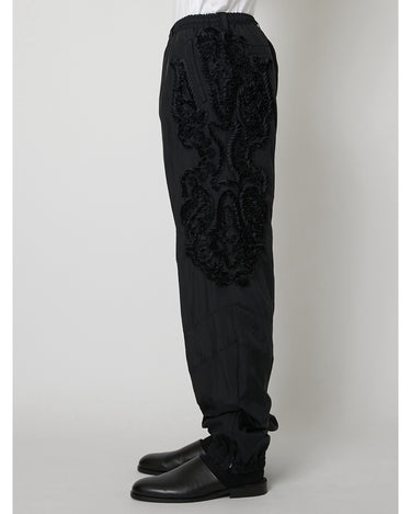 27SS予約受付中<br>【TAAKK】<br>SCULPTURAL Embroidered Windbreaker Pants